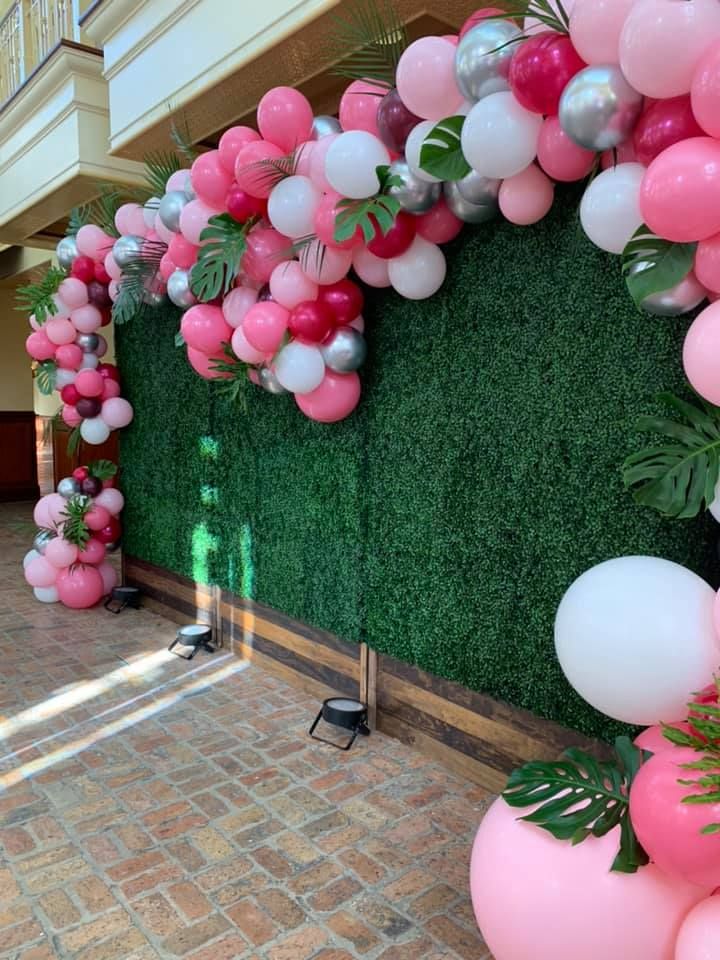 Pink on green wall